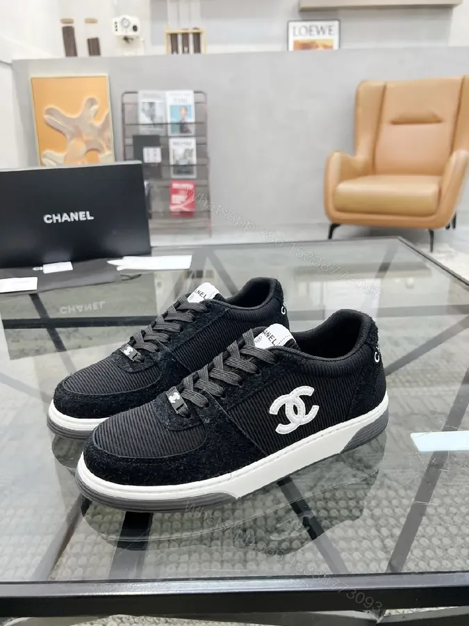 View 1 of Black Knit Sneaker + Leather-Texture Overlay + Minimalist + Signature Logo + Sneaker