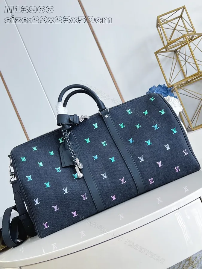 View 1 of Bold Denim Travel Bag with Multicolor Monogram Details