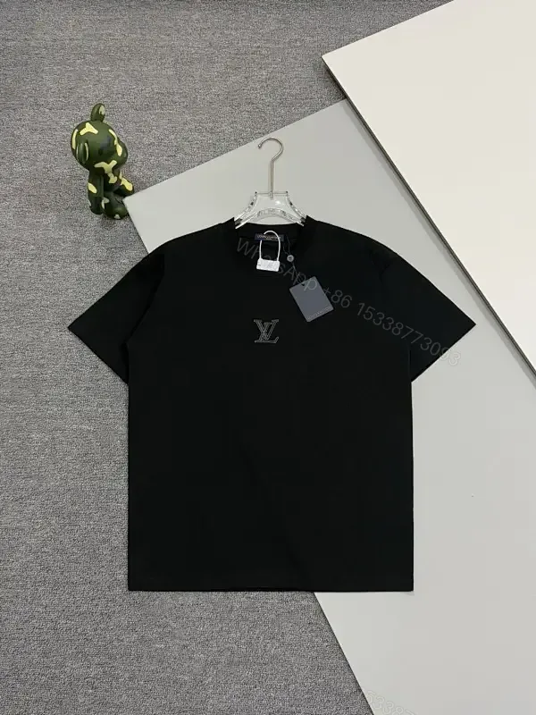 View 1 of Premium Black Tee — Discreet Logo, Soft Cotton Blend, Structured Fit