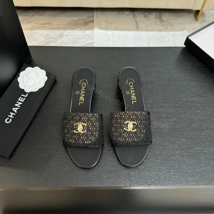 View 1 of Chic Knit-Texture Black Slip-Ons with Gold Hardware
