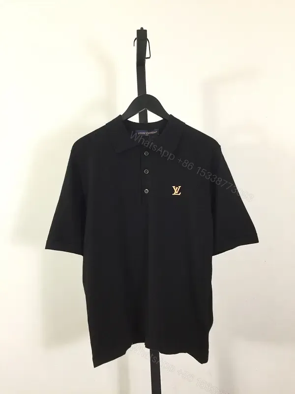 View 1 of Solid Black Polo Shirt with Gold LV Logo, Short Sleeves, Classic Collar