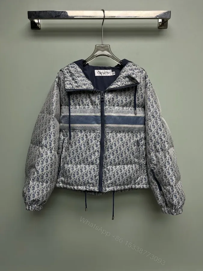 View 1 of Monochrome Puffer Jacket: Monogram Texture, Modern Warmth, Street-Ready Outerwear