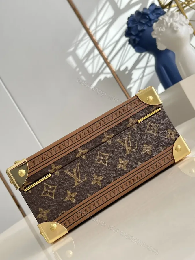 View 1 of Monogram Canvas Clutch with Gold Hardware - Structured Luxe Style