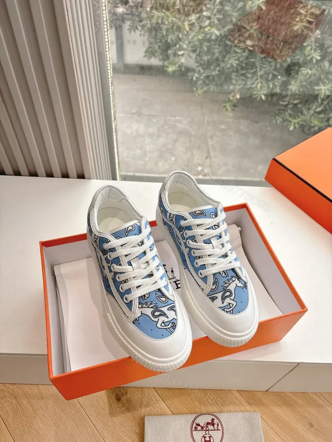 View 1 of Hermes Women Light Blue Canvas And White Sneakers