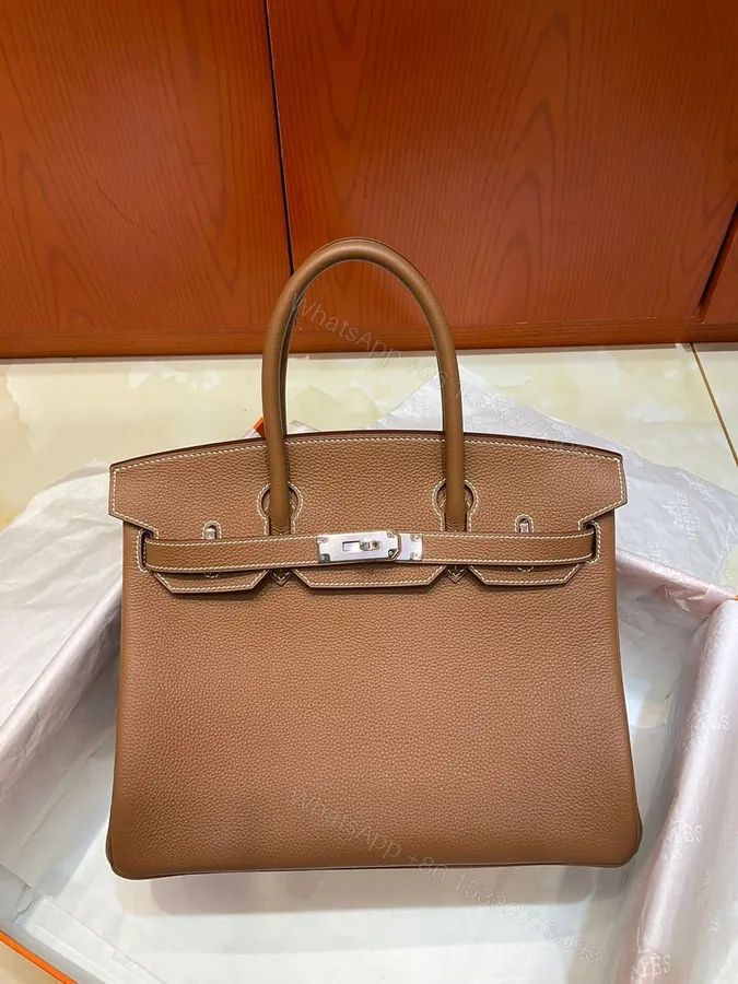 View 1 of Hermes Brikin 30 Gold with Sliver Hardware