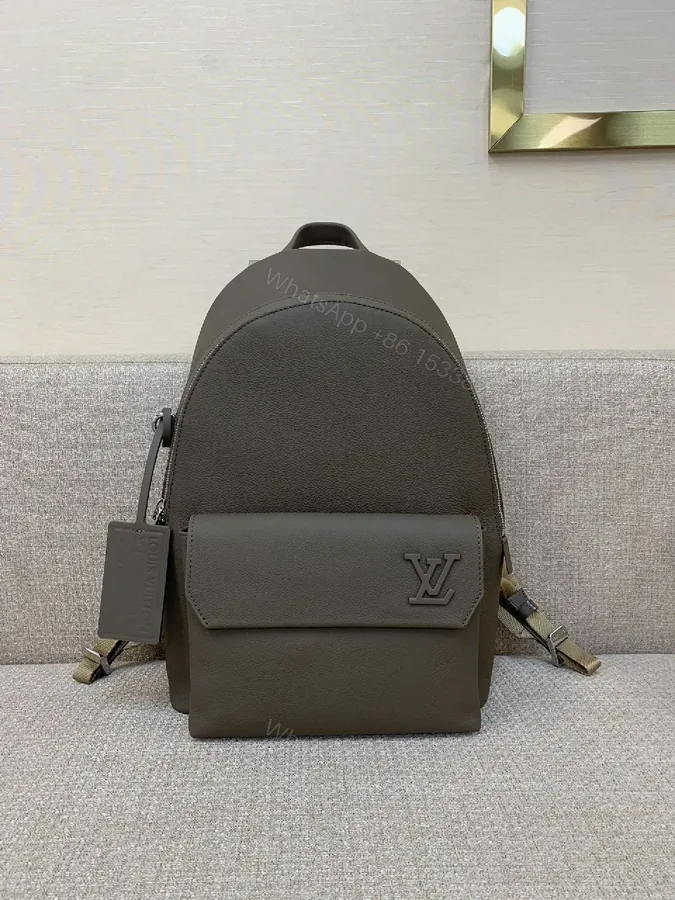 View 1 of Structured Minimalist Leather Backpack with Subtle LV Motif