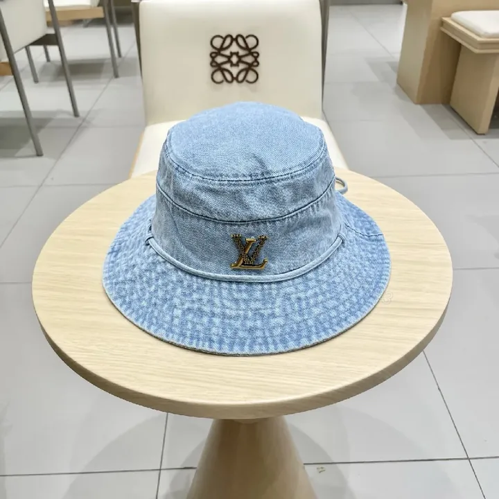 View 1 of Denim Bucket Hat + Gold Emblem + Casual Luxe + Iconic Accent + Hat