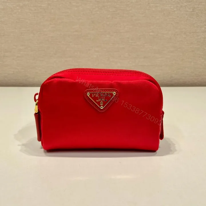 View 1 of CLUTCH 12 IN PASSION RED RE-NYLON