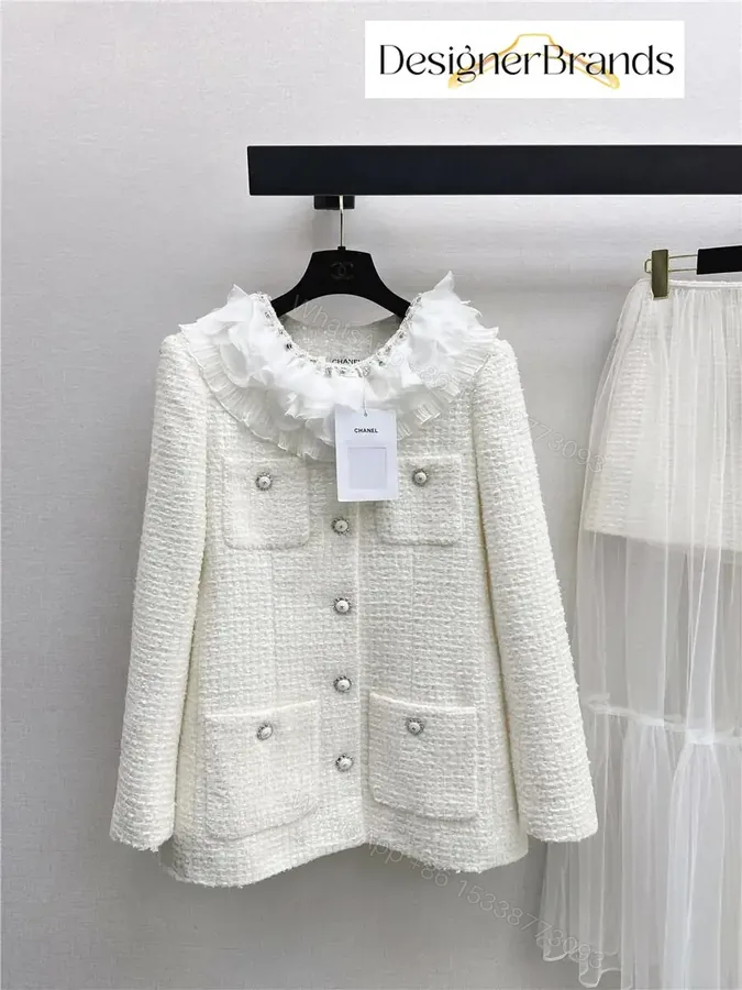 View 1 of Ivory Tweed Blazer with Ruffle Collar – Luxe, Structured Style