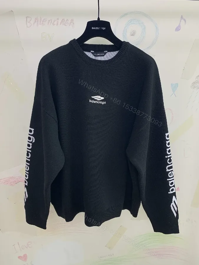 View 1 of Black Knit Luxe: Bold Texture, Subtle Branding Knitwear
