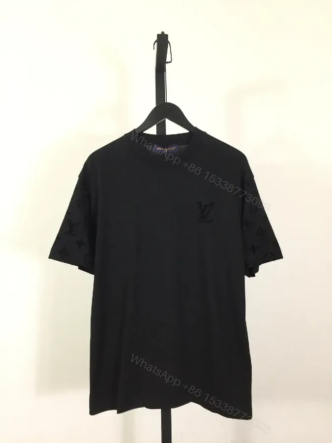 View 1 of Oversized Black Tee with Signature Embellishments — Modern Minimalism
