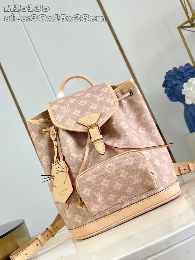 View 1 of Monogram Mini Backpack: Textured Leather, Compact Luxury
