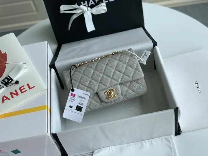 View 1 of Quilted Leather Crossbody: Compact Luxury with Gold Hardware