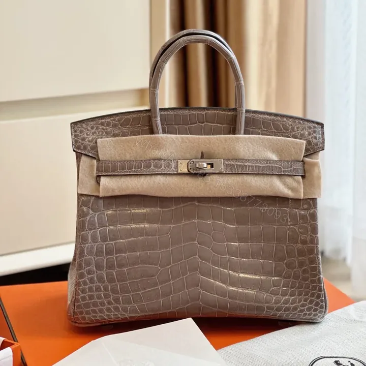 View 1 of HN Etoupe 25 Porosus Genuine Crocodile Leather Palladium Hardware