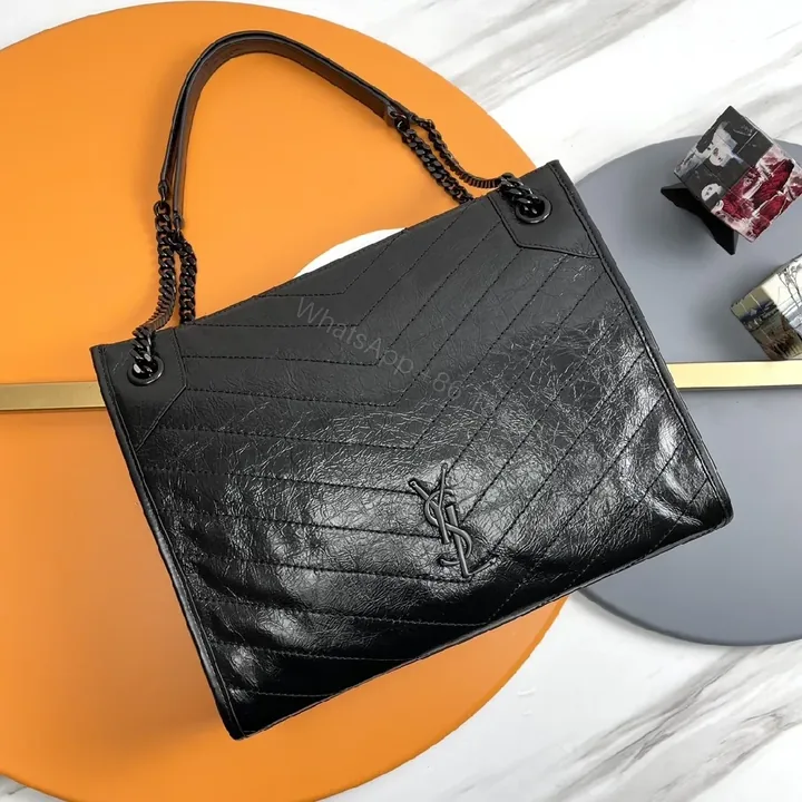 View 1 of Matte Black Quilted Leather Shoulder Bag: Chic Minimalist Style