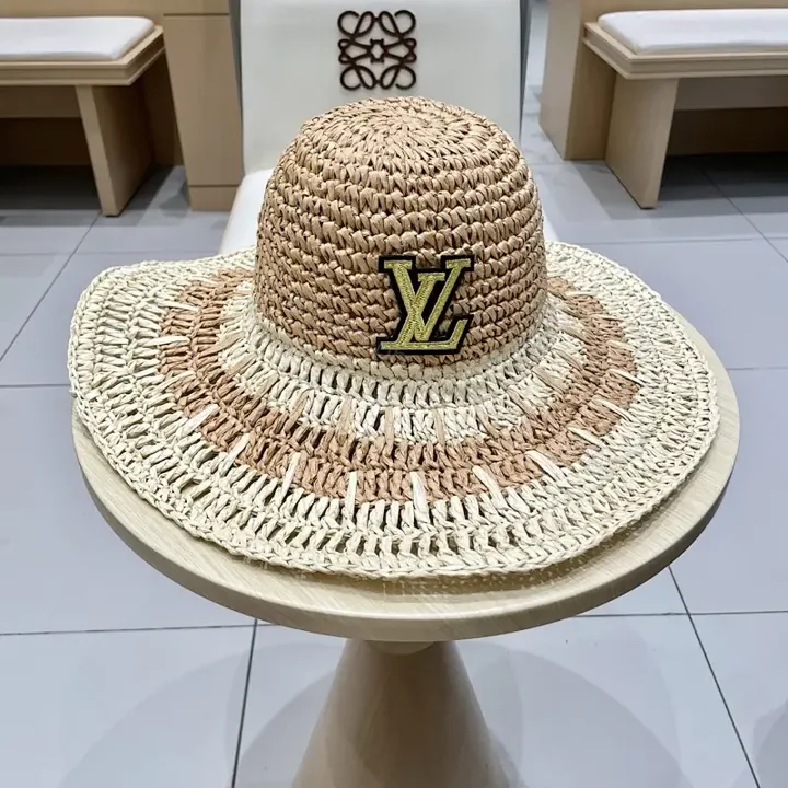 View 1 of Elegant Straw Hat with LV Emblem - Sun-Ready Luxury Hat