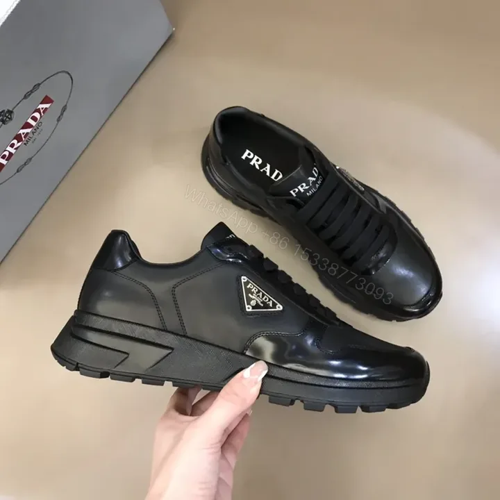 View 1 of Prada Black Leather Patent-Panel Sneakers, Discreet Luxury