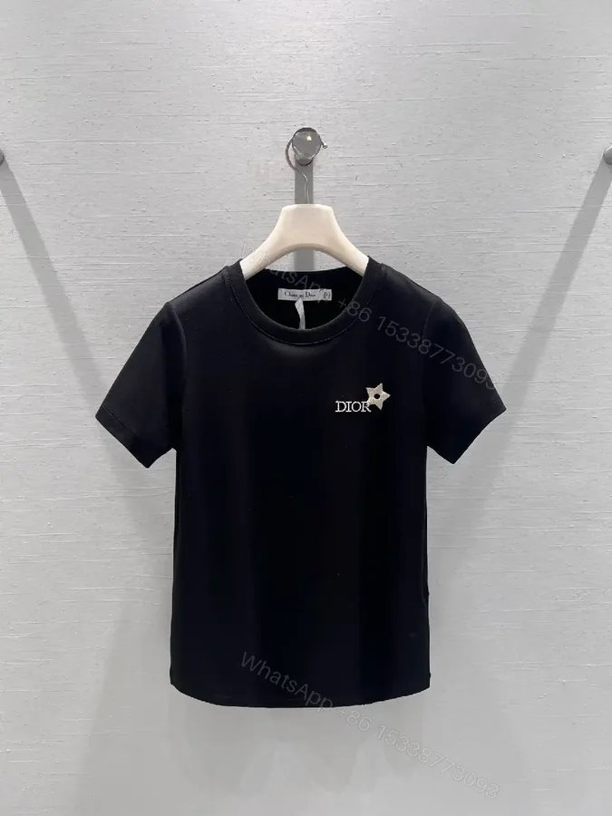 View 1 of Minimalist Black Cotton Tee with Discreet Emblem