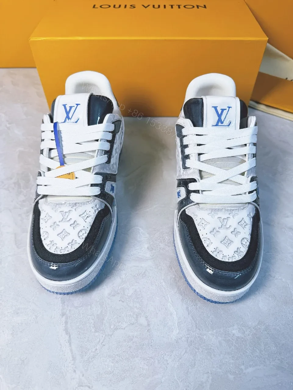 View 4 of Bold Navy Leather Textured Sneakers with LV Accent