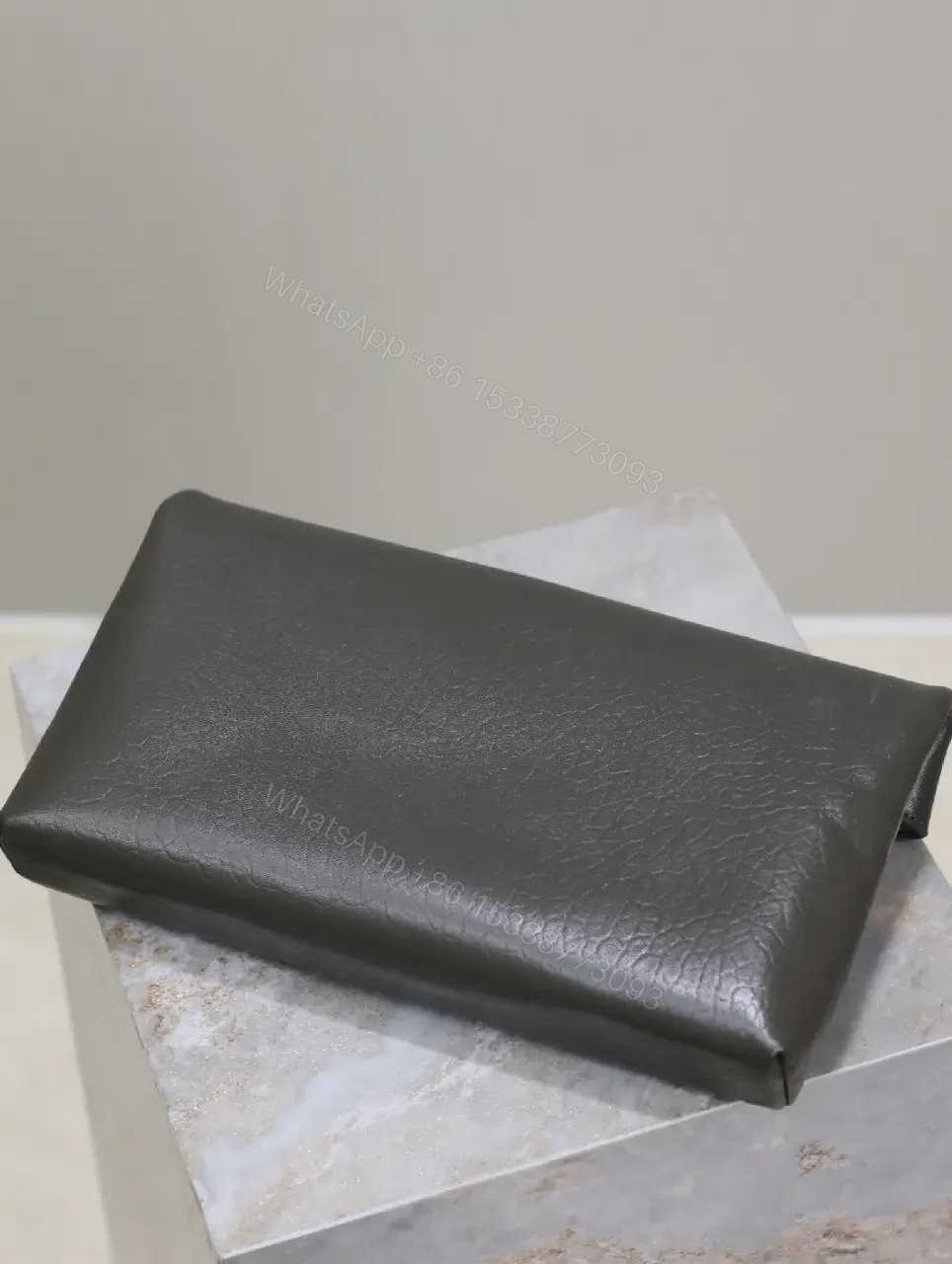 View 4 of Textured Black Leather Envelope Clutch with Gold Logo Signature