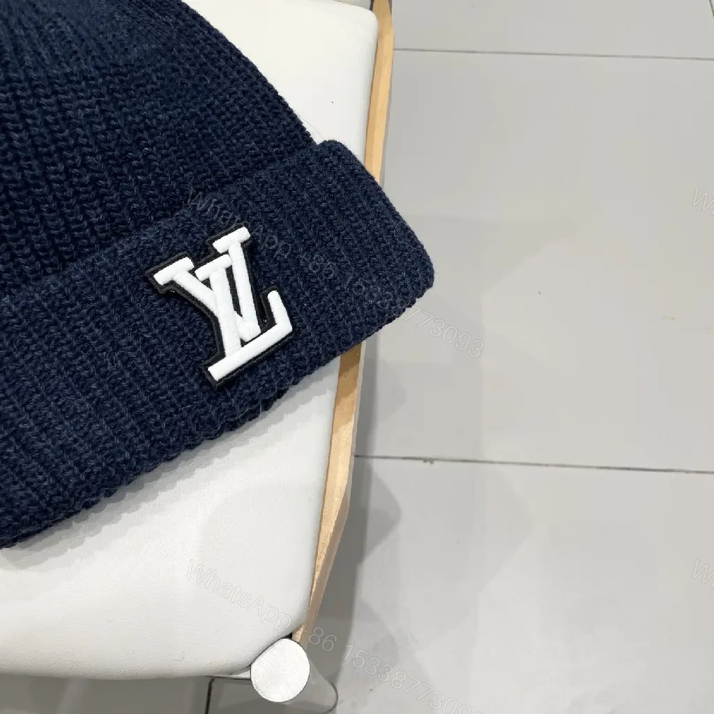 View 7 of Cozy Black Knit Beanie with Subtle Emblem Detail