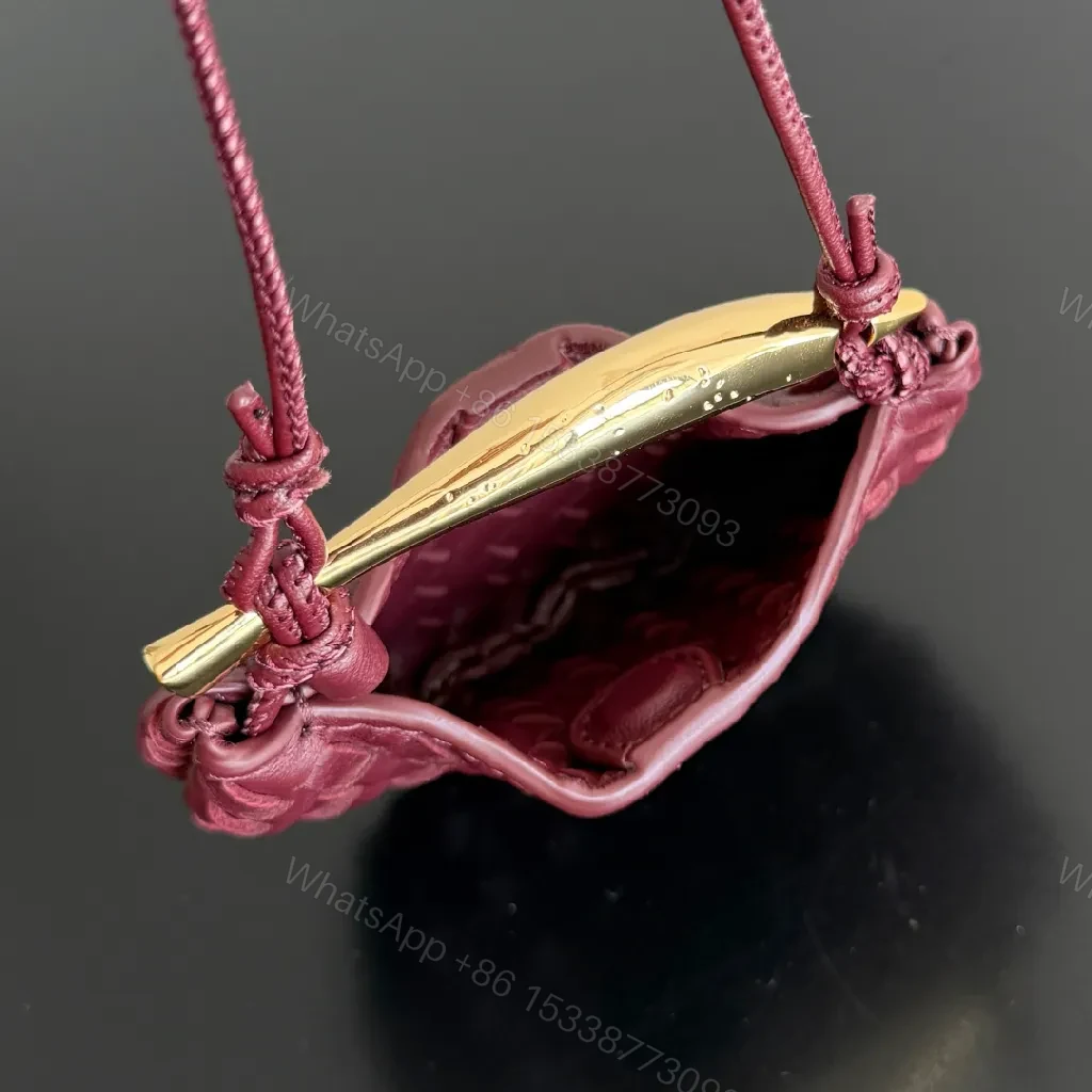 View 3 of Textured Plum Mini Bag: Handwoven Leather, Luxe Compact