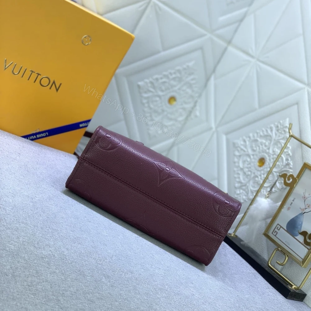 View 2 of Louis Vuitton Onthego MM Monogram Empreinte Wine Red 35Cm M46601