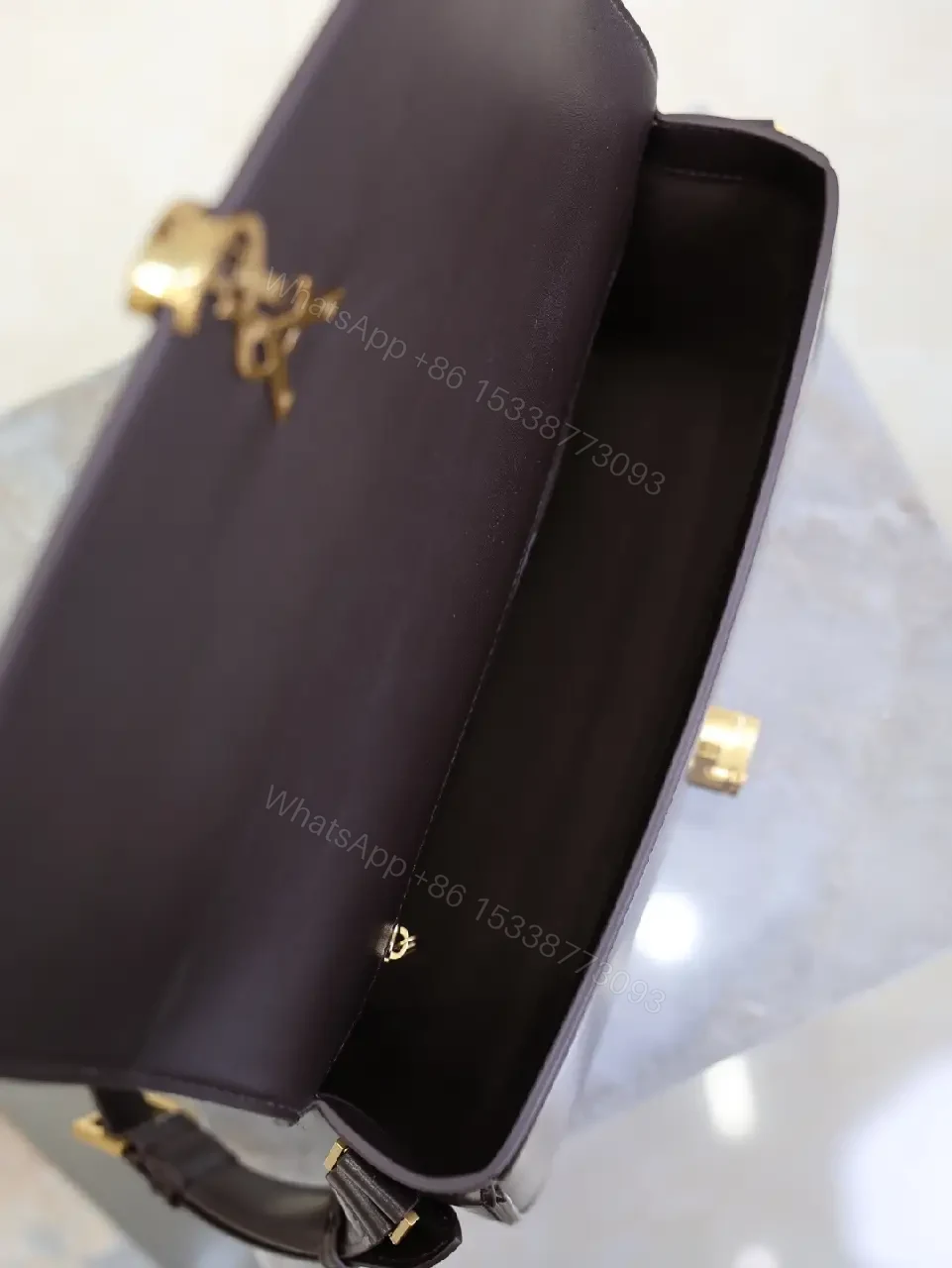 View 3 of Chic Leather Crossbody with Gold-Tone Hardware, Compact Carry
