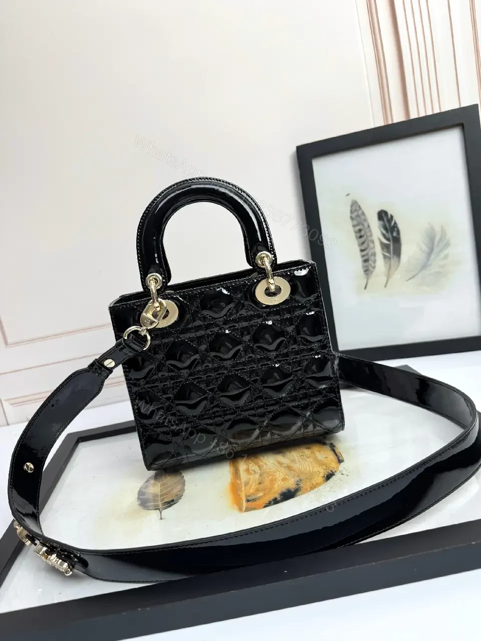 View 6 of Quilted Patent Mini Bag with Gold-Tone Charms, Black