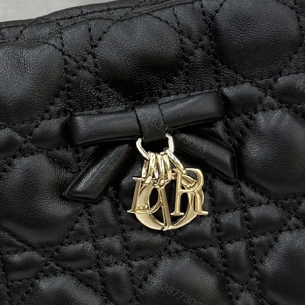 View 10 of Quilted Black Drawstring Bucket Bag with Gold Hardware