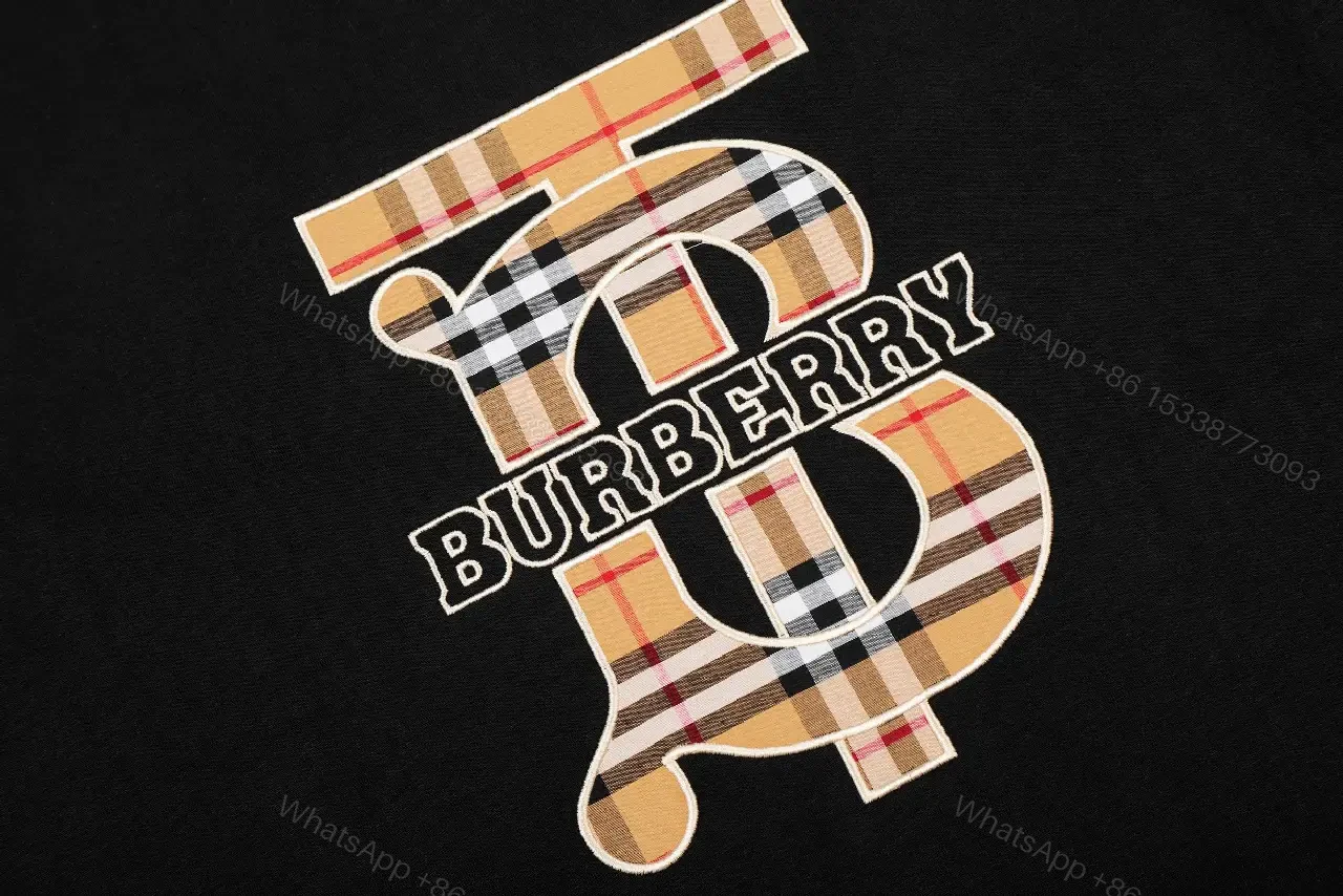 View 2 of Bold Logo Tee: Black Cotton, Modern Streetwear, Plaid Logo, Tee