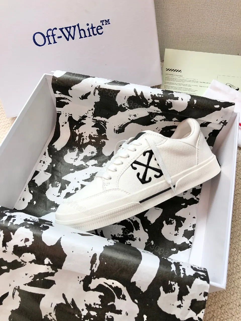 View 5 of Minimalist White Leather Low-Top Sneakers with Signature Detail
