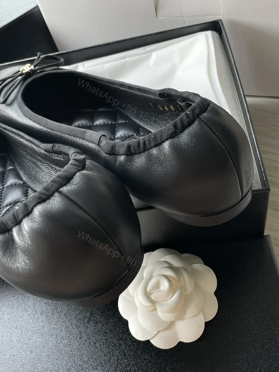 View 5 of Quilted Black Flats with Gold Logo Accents - Chic Comfort