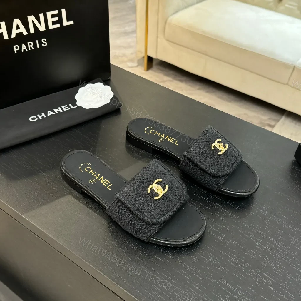 Quilted Black Slip-Ons with Gold Logo – Luxury Comfort — view 1