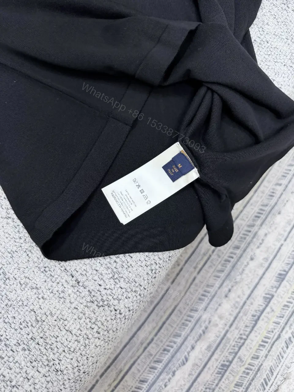 View 3 of Black Polo with Subtle Gold Logo - Refined Everyday Versatility