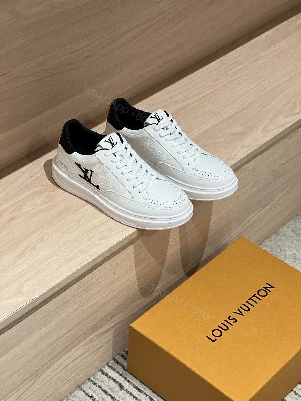 Minimalist White Leather Sneakers with Signature Detail - Modern Luxury — view 1