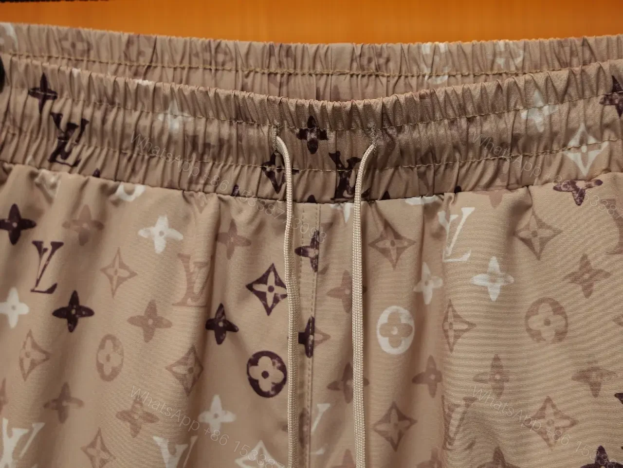 View 10 of Beige Monogram Print Drawstring Swim Shorts