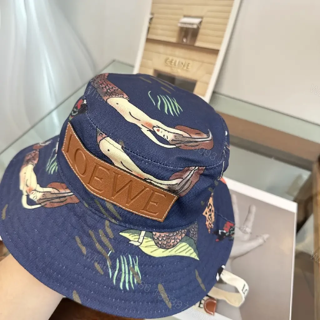 View 2 of Navy Floral Canvas Bucket Hat with Leather Brand Patch
