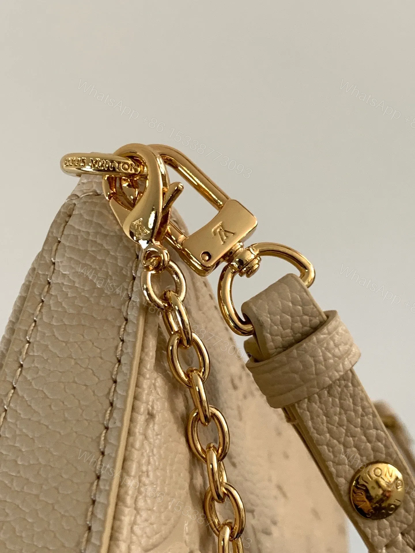 View 3 of LV EASY POUCH ON STRAP 19 IN BEIGE MONOGRAM EMPREINTE LEATHER