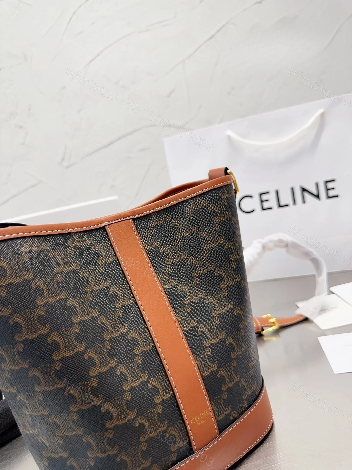 View 2 of CELINE SMALL BUCKET IN TRIOMPHE CANVAS AND CALFSKIN TAN 20CM 191442CAS04LU