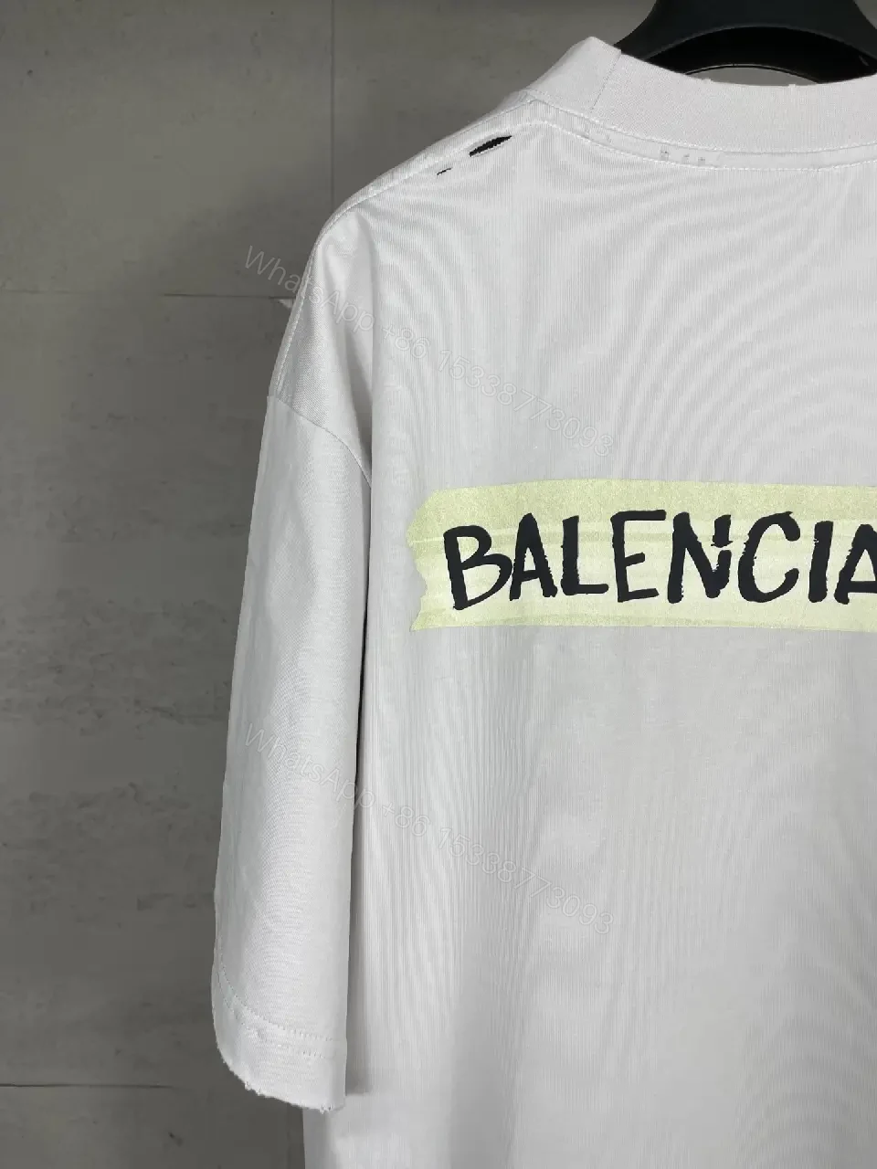 View 8 of Oversized White Tee with Signature Patch - Minimalist Luxe
