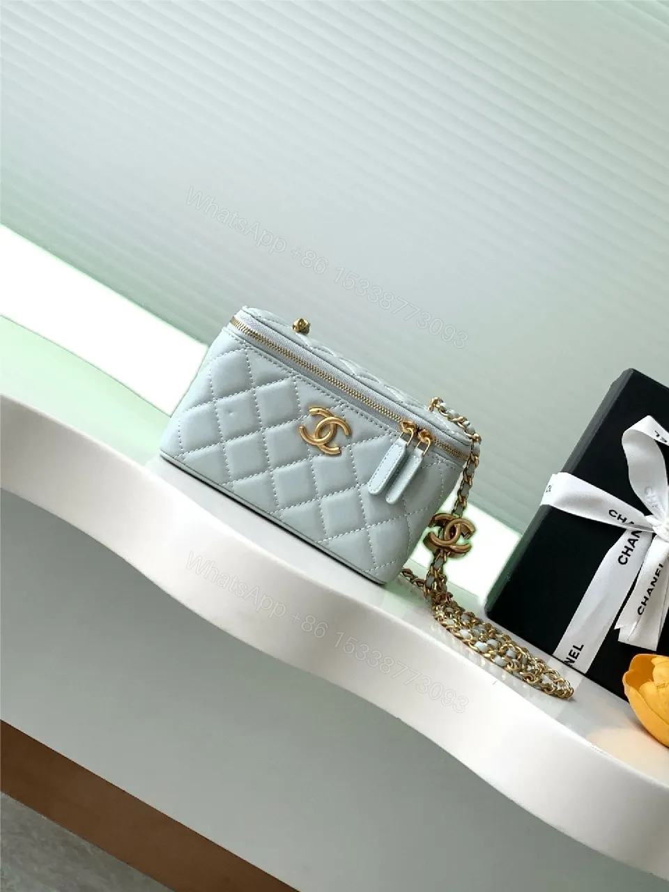Light Blue Quilted Mini Bag with Gold Accents and Chain — view 1