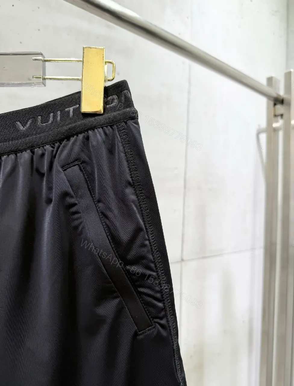 View 9 of Matte Black Quick-Dry Shorts with Subtle LV Detailing
