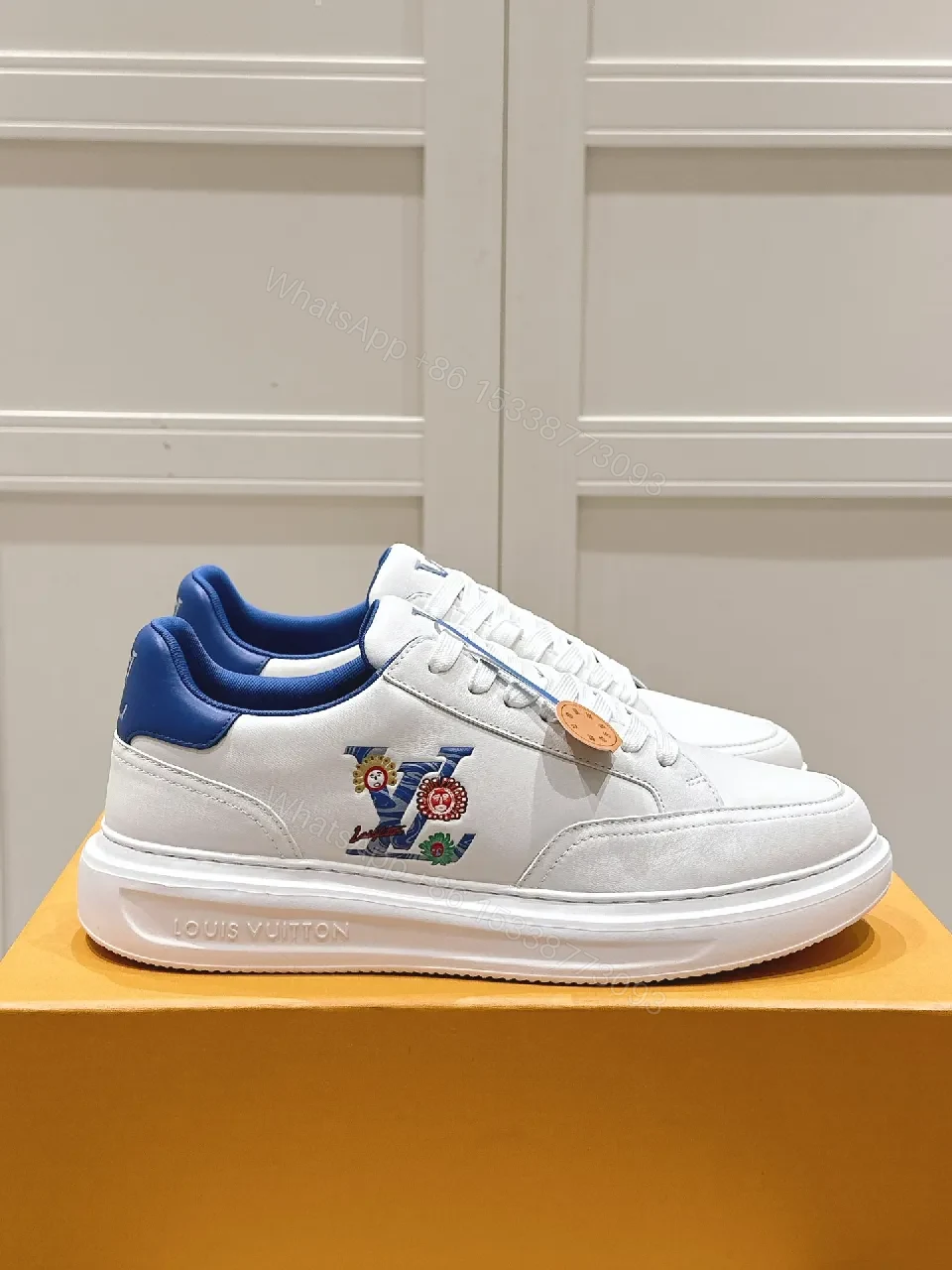 View 7 of Clean White Leather Low-Top Sneakers with Subtle Designer Embellishments