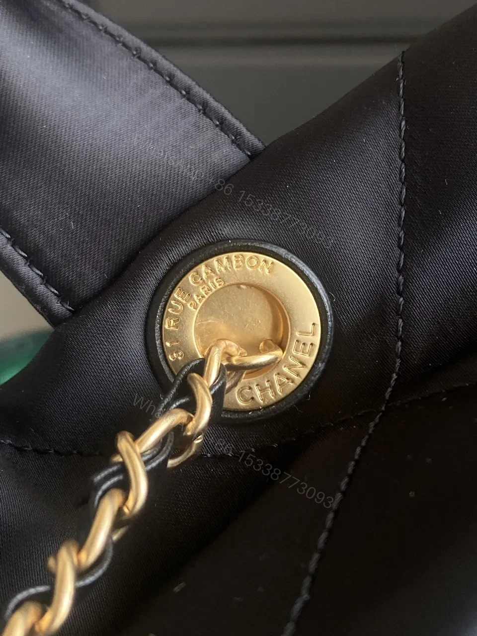View 2 of Quilted Black Bag with Gold Emblem - Luxury Everyday Style
