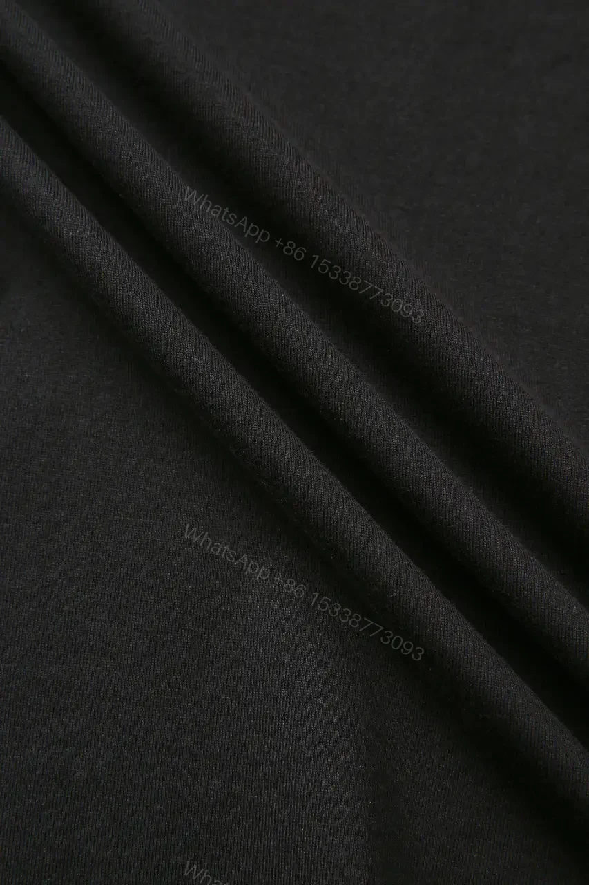 View 3 of Minimalist Black Cotton Tee with Subtle Embossed Logo - T‐Shirt