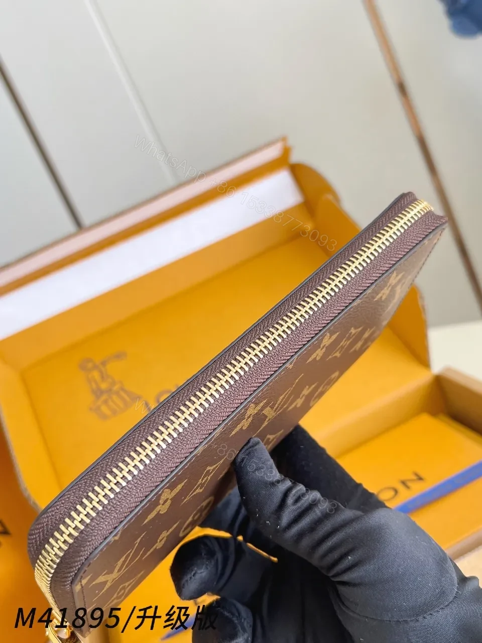 View 4 of Compact Monogram Leather Wallet: Signature Texture, Gold Zipper
