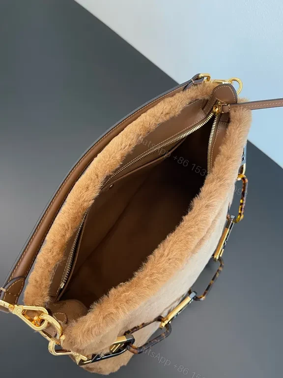 View 2 of Luxurious Fendi Fur Bag: Gold-Logo, Soft Texture, chic silhouette