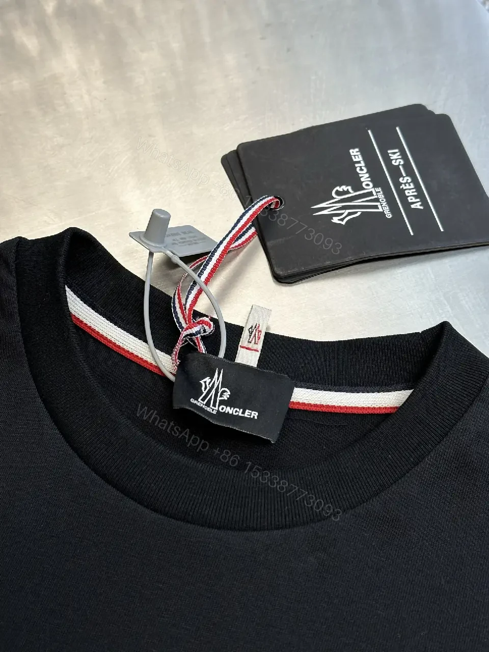 View 6 of Minimalist Black Tee with Logo Crest, Relaxed Fit, Premium Cotton