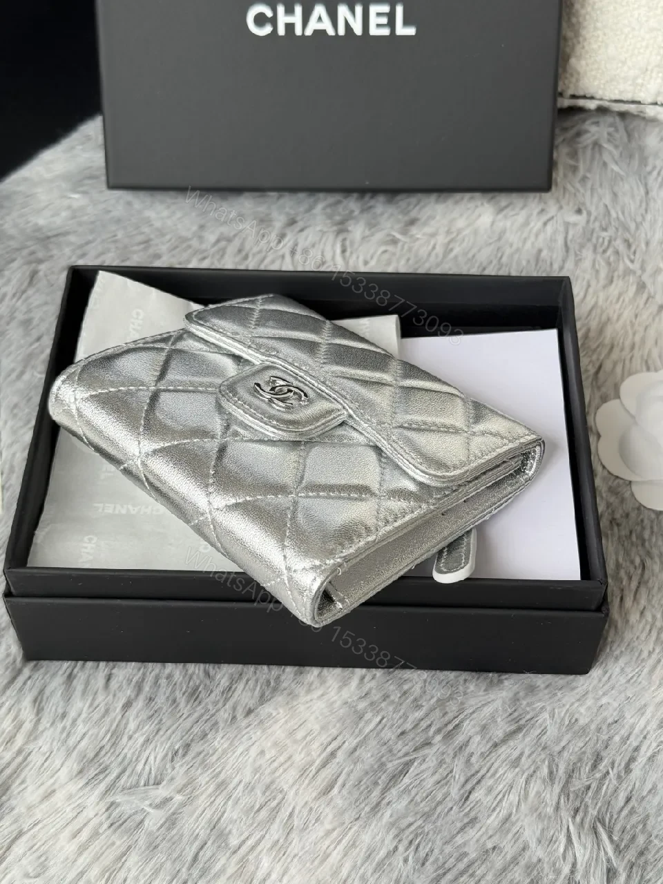 View 9 of Compact Silver Quilted Wallet with Signature Hardware